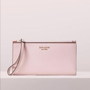 Brand New with receipts and box Kate Spade continental wristlet in tutu pink.
